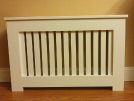 radiator cover without rounded edges and grill area has wider spacing between the slots.  It has a 3/4-inch gap between the slots. 