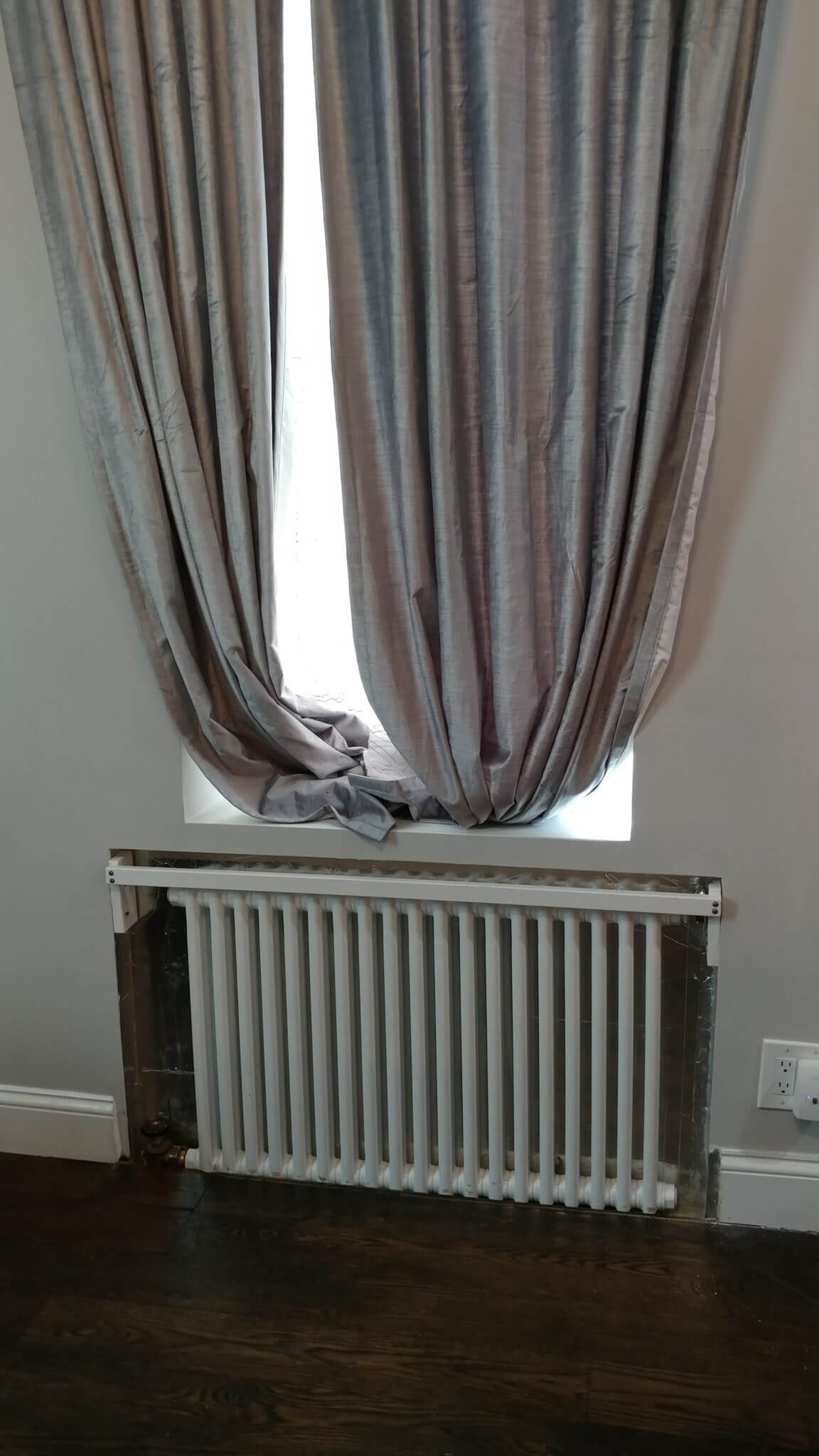 in-wall radiator under window